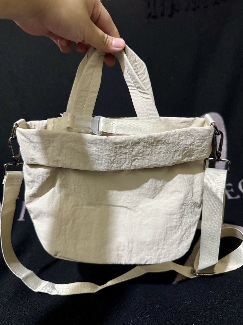 LLLemon Cross body Bag / Sling (Category: Cross-body Bags) located in Manila. Submitted by nmiamaya (Listing ID 1467115342, Image 1). Description: Lululemon Sling / Cross body Bag - Cream Color - Polyester & Nylon Material - (still with tag) - Micro 5L .