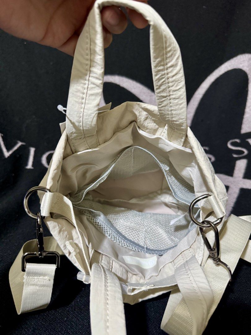 LLLemon Cross body Bag / Sling (Category: Cross-body Bags) located in Manila. Submitted by nmiamaya (Listing ID 1467115342, Image 2). Description: Lululemon Sling / Cross body Bag - Cream Color - Polyester & Nylon Material - (still with tag) - Micro 5L .
