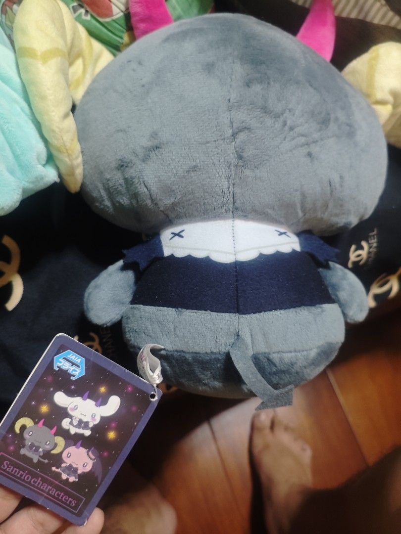 Lloromanic Berry (Big Variant) (Category: Plushies & Soft Toys) located in Caloocan City. Submitted by wallingsott (Listing ID 1466999442, Image 2). Description: - Authentic Sanrio devil-style plush toy in excellent, clean condition - Unique grey body with striking bright pink horns and yellow side horns - Dressed in a charming dark blue vest with a matching bow tie and white collar - Features a cute devil arrow-shaped tail - Original tag still a