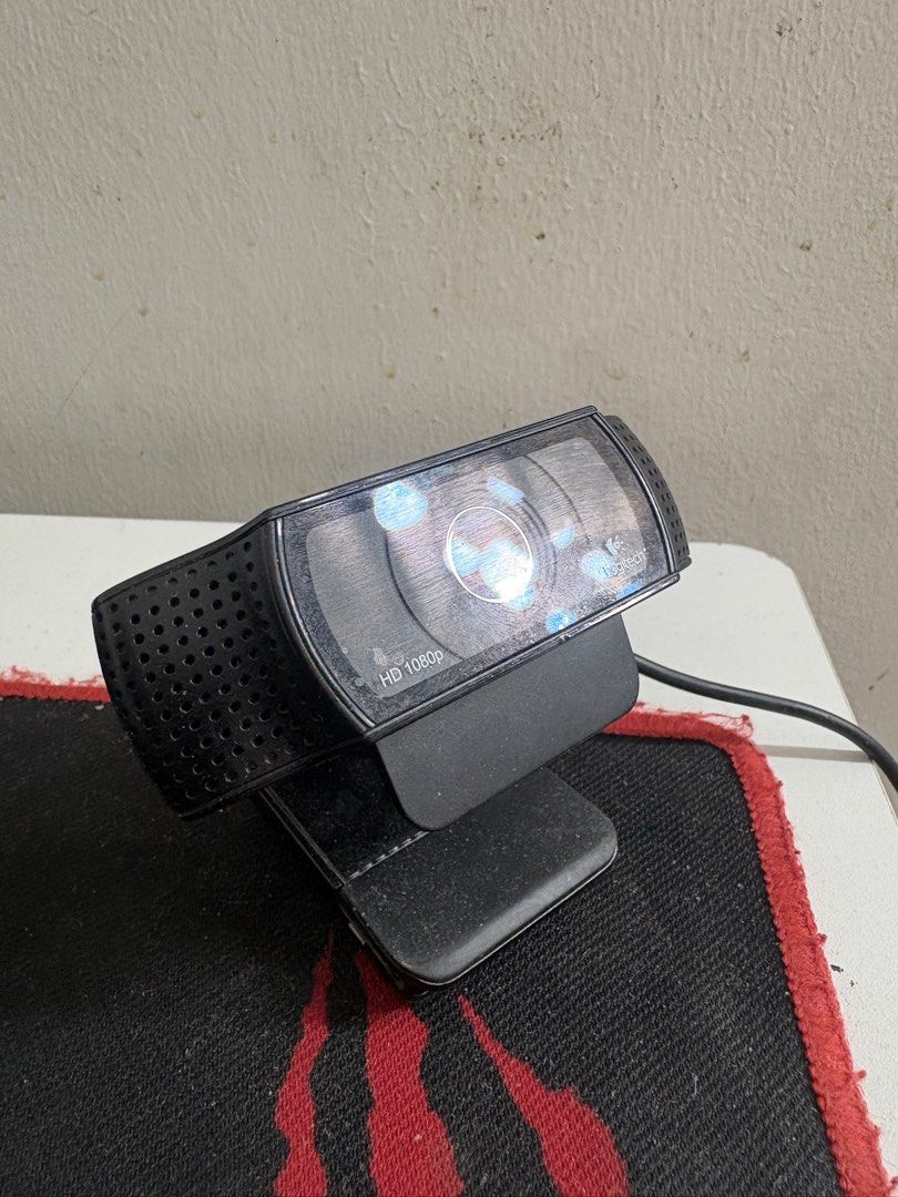 Logitech HD 1080p Webcam (Category: Webcams) located in Quezon City. Submitted by sellerofused (Listing ID 1466988923, Image 1). Description: - Brand: Logitech Webcam - Resolution: HD 1080p for clear video calls - Color/Design: Black finish with stylish side speaker grilles - Stand: Adjustable monitor mount included for easy setup - Connectivity: Attached USB cable ready to plug and play - Condition: Dusty from sitting on the desk, but fully work