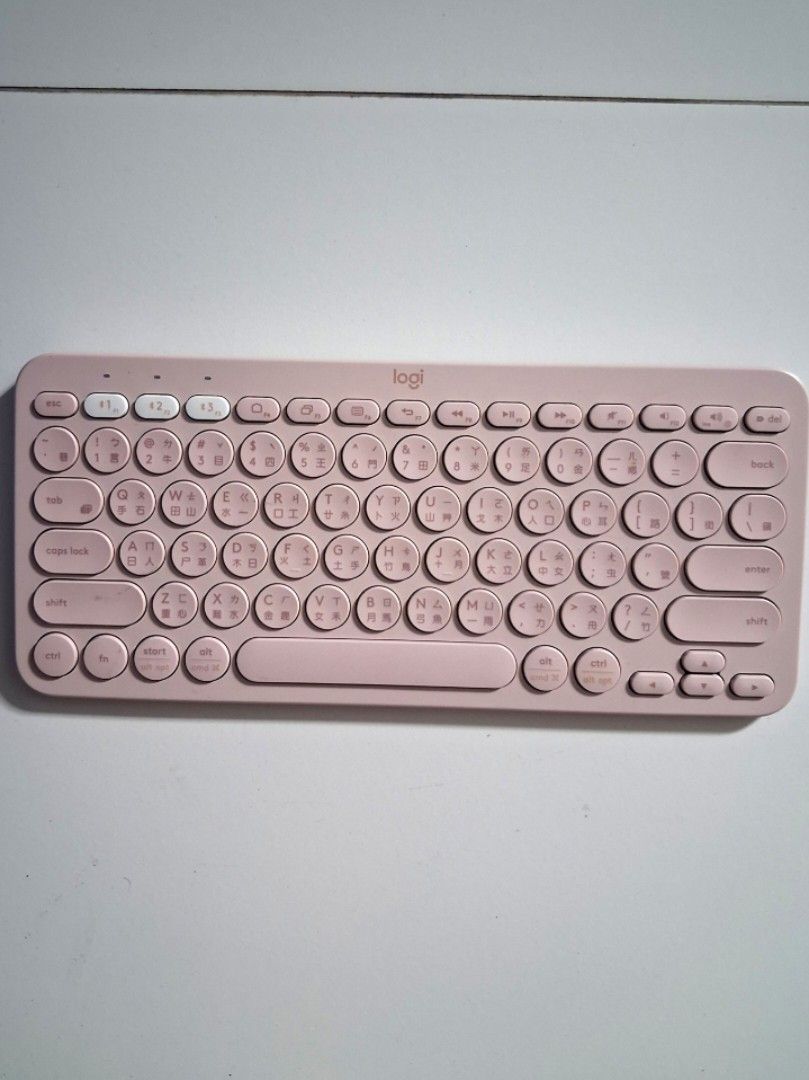 Logitech K380 Bluetooth Keyboard Pink (Category: Computer Keyboard) located in Legazpi City. Submitted by flordelotus (Listing ID 1466987679, Image 2). Description: - Color: Cute Pink - Layout: Compact with stylish round keys - Keycaps: Features Traditional Chinese characters alongside English letters - Multi-Device: 3 Easy-Switch buttons to connect up to 3 devices simultaneously - Compatibility: Works seamlessly with phones, tablets, and laptops