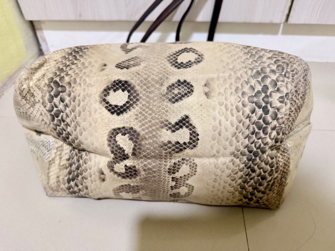 Longchamp Tote Bag Python Snake Print Leather (Category: Luxury Bags & Wallets) located in Manila. Submitted by rrtolibas48132 (Listing ID 1467065501, Image 3). Description: - Brand: Longchamp - Design: Python snake print canvas with brown leather handles and flap - Hardware: Silver-tone with PRYM snap button - Closure: Secure zip top - Interior: Includes a handy zippered compartment - Straps: Comfortable double leather straps for shoulder carry 