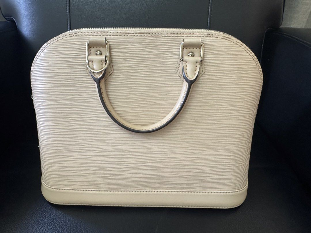 Louis Vuitton Alma bag (Category: Luxury Bags & Wallets) located in Dipolog. Submitted by skylab79 (Listing ID 1466998552, Image 2). Description: Selling my Louis Vuitton Alma PM in Epi Leather, Dune Ivory color — a sophisticated and elegant handbag that never goes out of style. Its structured silhouette, iconic design, and refined ivory shade make it a stunning addition to any luxury handbag collection. Material: Epi Leather Color: Dune Ivory Co