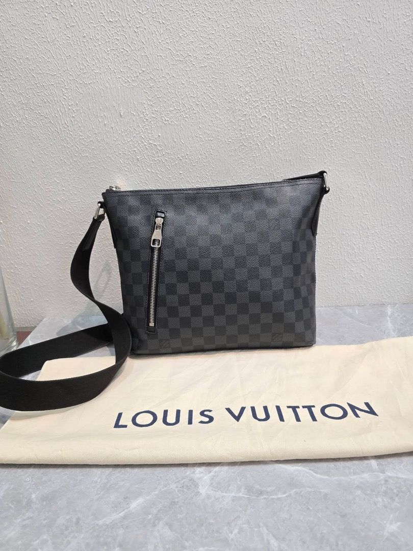 Louis Vuitton Damier Graphite District Messenger Bag (Category: Luxury Bags & Wallets) located in Davao. Submitted by sharpeeeee_ (Listing ID 1466975831, Image 2). Description: - Authentic Louis Vuitton messenger bag in iconic Damier Graphite canvas - Sleek dark grey and black checkered pattern with silver-tone hardware - Functional front vertical zip pocket for easy access - Comfortable, adjustable black fabric shoulder strap - Spacious interior