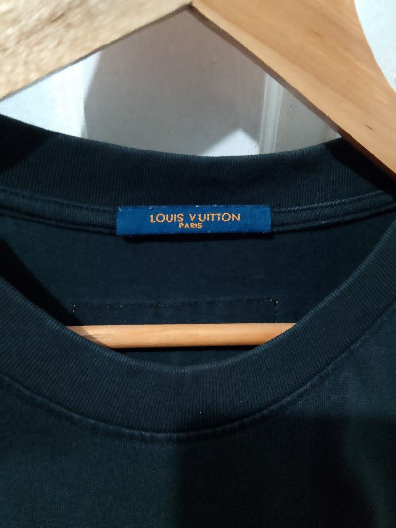 Louis Vuitton Do A Kickflip T-Shirt Black (Category: Tshirts & Polo Shirts ) located in Caloocan City. Submitted by wirlynbina94604 (Listing ID 1467127633, Image 2). Description: - Brand: Louis Vuitton - Color: Black with blue accents - Design: 'DO A KICKFLIP' snowy front text and large blue snow-detailed LV logo on the back - Cut: Crew neckline, short sleeves - Details: Blue collar tag with gold branding and CA 36929 code - Condition: Excellent 