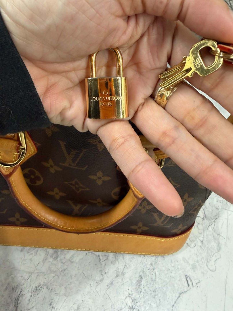 Louis Vuitton Monogram Alma BB Handbag (Category: Luxury Bags & Wallets) located in Angono. Submitted by xxxallaboutbagsxxx (Listing ID 1467129549, Image 3). Description: - Authentic Louis Vuitton Monogram canvas handbag with classic structured shape - Beautiful natural cowhide leather trim with a light honey patina - Dual rolled top handles and a convenient detachable shoulder strap - Secure double zip closure with gold-tone hardware throughout 