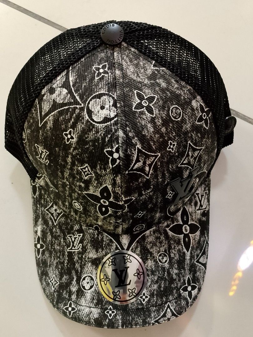 Louis Vuitton Monogram Black And White Mesh Trucker Cap (Category: Caps & Hats) located in Quezon City. Submitted by viaggo.travels (Listing ID 1467039133, Image 1). Description: - Iconic black and white L V monogram print - Breathable mesh back panels for all-day comfort - Adjustable leather strap with embossed branding for a custom fit - Circular metallic L V logo on the front brim and dark L. V side emblem - Brand new with hang tag attached.