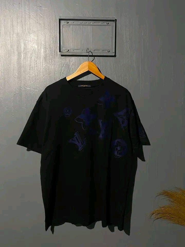 Louis Vuitton Monogram Blue Black T-Shirt (Category: Tshirts & Polo Shirts ) located in Manila. Submitted by bright.mayess (Listing ID 1467059382, Image 1). Description: - Brand: Louis Vuitton Paris - Color: Black with blue monogram print - Style: Short sleeves, crew neck - Details: Interior tag includes CA 36929 and Louis Vuitton Japan K.K. info - Condition: Clean fabric, excellent graphic placement - Ideal for casual luxury wear.