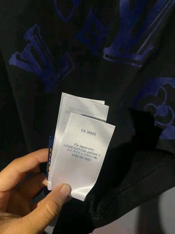 Louis Vuitton Monogram Blue Black T-Shirt (Category: Tshirts & Polo Shirts ) located in Manila. Submitted by bright.mayess (Listing ID 1467059382, Image 2). Description: - Brand: Louis Vuitton Paris - Color: Black with blue monogram print - Style: Short sleeves, crew neck - Details: Interior tag includes CA 36929 and Louis Vuitton Japan K.K. info - Condition: Clean fabric, excellent graphic placement - Ideal for casual luxury wear.