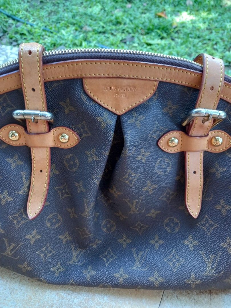 Louis Vuitton Monogram Canvas Handbag (Category: Luxury Bags & Wallets) located in Davao. Submitted by kirk214red-50020 (Listing ID 1466983065, Image 2). Description: - Classic Louis Vuitton monogram canvas with brown leather trim - Dual top handles and stylish front buckle strap details - Secure top zip closure with gold-tone hardware - Roomy brown fabric-lined interior featuring multiple slip pockets - Features Louis Vuitton Paris heat stamp ne