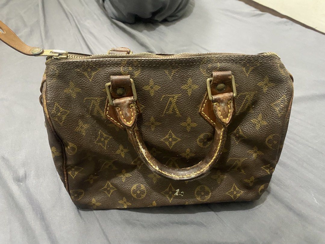Louis Vuitton Monogram Canvas Speedy Handbag (Category: Luxury Bags & Wallets) located in Manila. Submitted by fiercefire_ec9997 (Listing ID 1467108541, Image 2). Description: - Authentic Louis Vuitton Speedy bag in classic brown Monogram canvas - Dual leather top handles with a rich patina and noticeable wear - Secure brass hardware zipper closure with pull tab - Brown textile interior lining featuring a convenient side pocket - Shows visible we