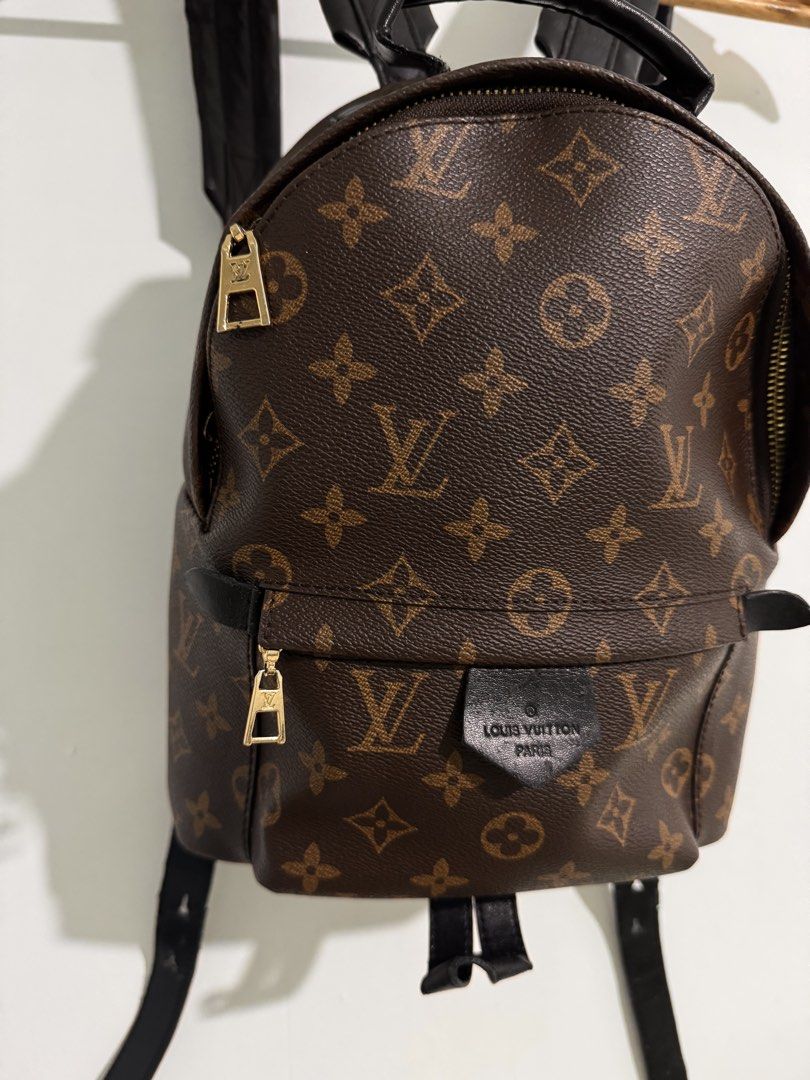 Louis Vuitton Palm Springs PM Monogram Black Leather Backpack (Category: Backpacks) located in Cavite. Submitted by aldrindela40142 (Listing ID 1466990895, Image 3). Description: - Louis Vuitton Palm Springs PM backpack - Iconic Monogram canvas with sleek black leather trim and gold-tone hardware - Functional front zip pocket with stamped LV pull tab - Comfortable, adjustable black leather shoulder straps and top handle - Classic everyday luxury 