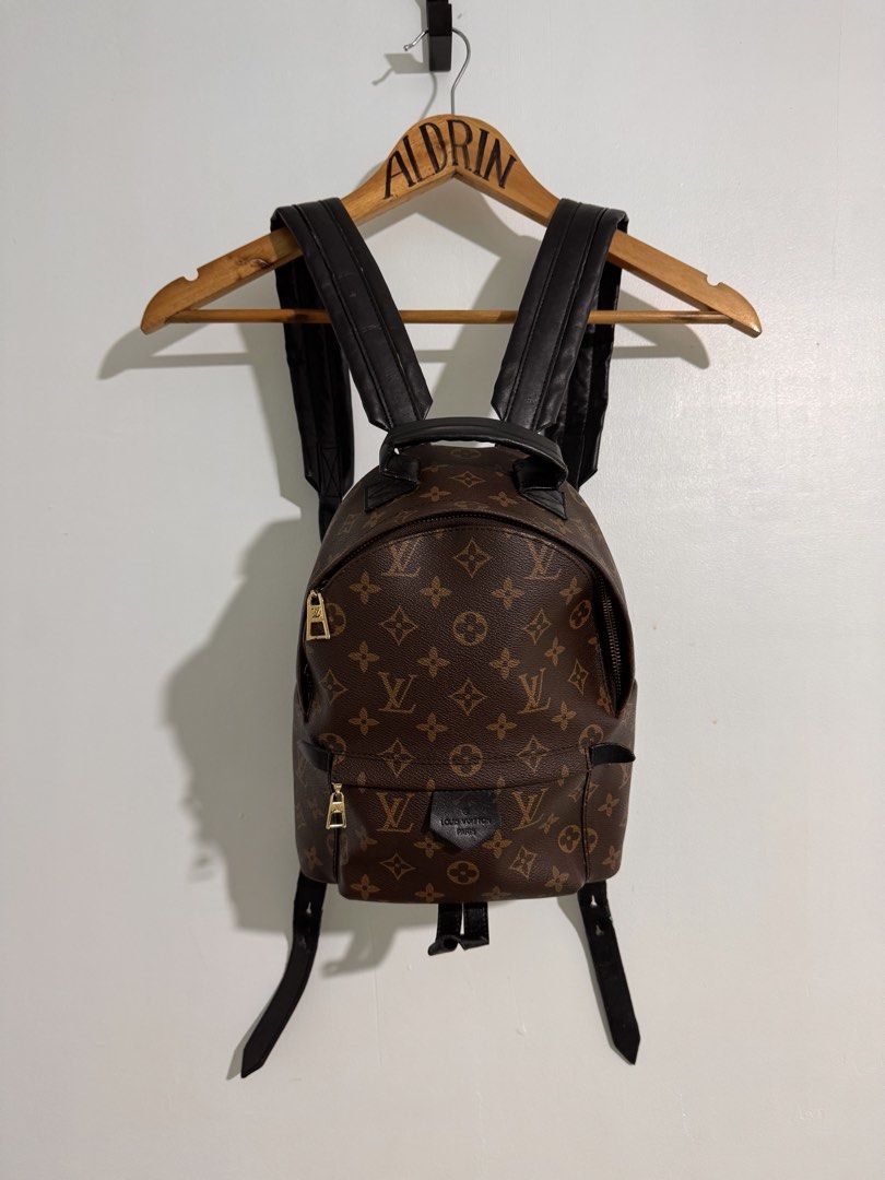 Louis Vuitton Palm Springs PM Monogram Black Leather Backpack (Category: Backpacks) located in Cavite. Submitted by aldrindela40142 (Listing ID 1466990895, Image 1). Description: - Louis Vuitton Palm Springs PM backpack - Iconic Monogram canvas with sleek black leather trim and gold-tone hardware - Functional front zip pocket with stamped LV pull tab - Comfortable, adjustable black leather shoulder straps and top handle - Classic everyday luxury 