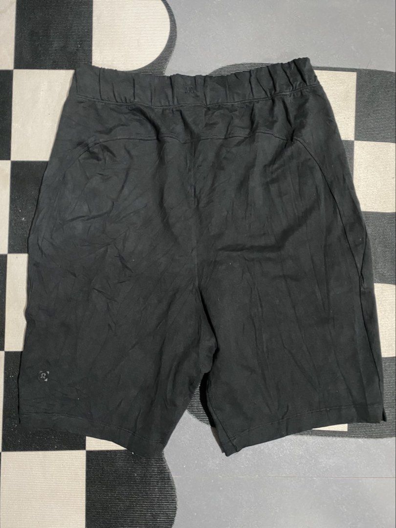 Lululemon Black Shorts Size M (Category: Activewear) located in Las Pinas. Submitted by matilliano76499 (Listing ID 1467143640, Image 3). Description: - Brand: Lululemon - Color: Black - Size: Medium (M) - Waistband: Elastic with adjustable drawstring and branded metallic tips - Pockets: Two functional front pockets - Details: Subtle logo stamp on the lower leg - Versatility: Perfect for everyday workouts or casual lounging.