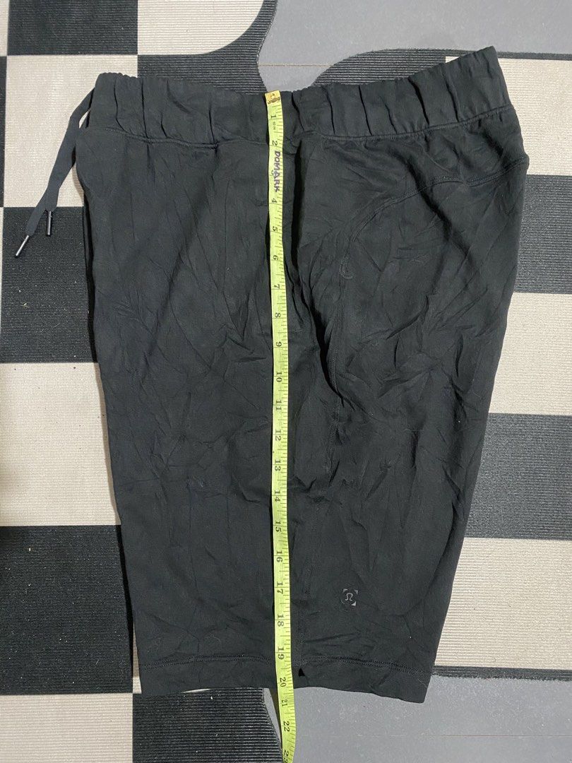 Lululemon Black Shorts Size M (Category: Activewear) located in Las Pinas. Submitted by matilliano76499 (Listing ID 1467143640, Image 2). Description: - Brand: Lululemon - Color: Black - Size: Medium (M) - Waistband: Elastic with adjustable drawstring and branded metallic tips - Pockets: Two functional front pockets - Details: Subtle logo stamp on the lower leg - Versatility: Perfect for everyday workouts or casual lounging.