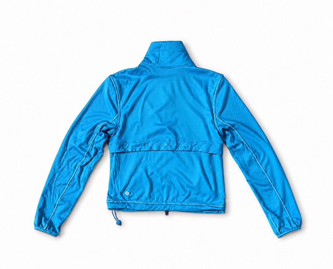 Lululemon Blue Zip-Up Athletic Jacket Size 0 (Category: Coats, Jackets and Outerwear) located in Zamboanga. Submitted by dayangjail94920 (Listing ID 1467150643, Image 2). Description: - Brand: Lululemon - Condition: Brand new with tags (never worn) - Size: 0 - Color: Bright blue - Design: Full zip front, high collar, and zippered pockets - Material: Lightweight, textured, and breathable fabric - Fit: Adjustable toggle cords on the elastic hem - S