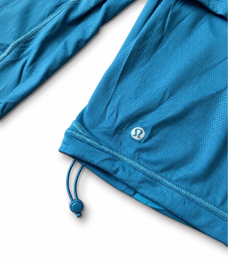 Lululemon Blue Zip-Up Athletic Jacket Size 0 (Category: Coats, Jackets and Outerwear) located in Zamboanga. Submitted by dayangjail94920 (Listing ID 1467150643, Image 3). Description: - Brand: Lululemon - Condition: Brand new with tags (never worn) - Size: 0 - Color: Bright blue - Design: Full zip front, high collar, and zippered pockets - Material: Lightweight, textured, and breathable fabric - Fit: Adjustable toggle cords on the elastic hem - S