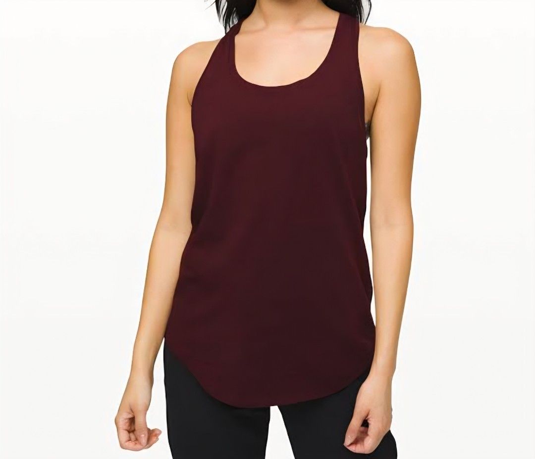 Lululemon love tank (Category: Activewear) located in San Pablo. Submitted by allyourbrandedneeds (Listing ID 1467040352, Image 2). Description: - Brand: Lululemon - Color: Deep maroon - Style: Racerback with scoop neckline and curved hem - Logo: Signature Lululemon logo on upper back - Material: Soft, stretchy, and breathable fabric - Condition: Excellent, clean with intact seams - Ideal for: Workouts, running, yoga, or casual everyday wear.