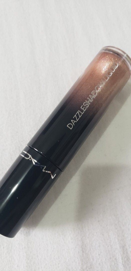 MAC Dazzleshadow Liquid - Beaming Brighter (Category: Makeup) located in Makati City. Submitted by doughrise28 (Listing ID 1467062347, Image 1). Description: - Authentic MAC Dazzleshadow Liquid eyeshadow - Shade: Beaming Brighter (Shimmery bronze) - Long-wearing sparkle finish - Easy application with built-in wand - Standard full-size tube.