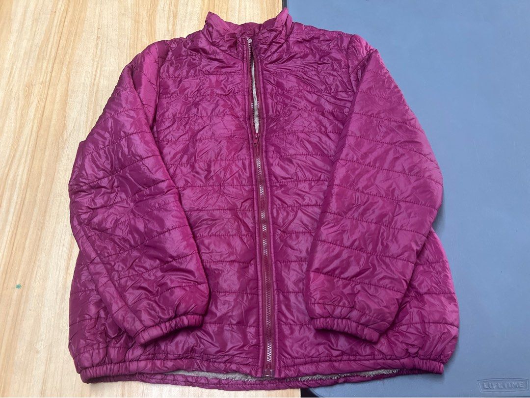 Magenta Puffer Jacket with Faux Fur Lining (Category: Coats, Jackets and Outerwear) located in Bulacan. Submitted by Domozz (Listing ID 1467050464, Image 3). Description: - Color: Bright magenta - Design: Quilted puffer jacket with soft grey faux fur lining - Features: Full zip front closure and practical side pockets - Comfort: Elastic cuffs and hem to lock in heat - Condition: Great piece for cold weather travels or chilly days XL to XXL PINK .