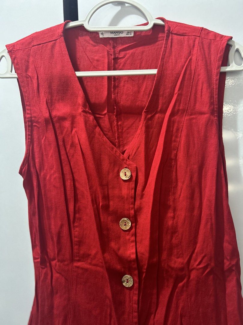 Mango Button-Down Linen Mini Dress in Crimson Red (Category: Dresses) located in Pasig City. Submitted by ladyleslieisletavelarde4902 (Listing ID 1467083087, Image 2). Description: A vibrant, chic sleeveless mini dress crafted in breathable linen fabric, complete with a flattering V-neck and wooden button-front detail. Brand: Mango (MANGO Casual) Tag Size: EUR S / USA 4 Recommended Fit: Fits Small Color: Vibrant Crimson / Ruby Red Features: Sleev