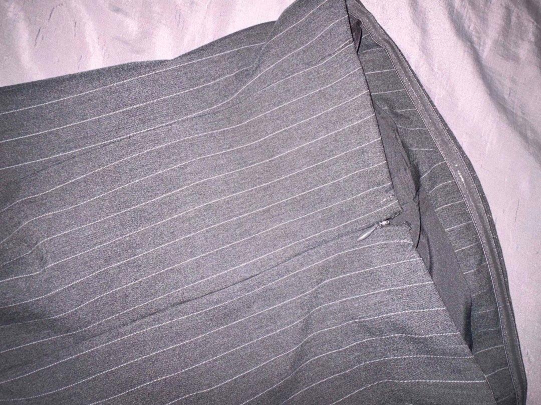 Mango tube top Pinstripe Grey (Category: Sleeveless) located in Manila. Submitted by jasja (Listing ID 1467013790, Image 3). Description: - Color & Pattern: Grey with subtle vertical pinstripes - Fit & Style: Tailored bodice with a clean, straight neckline - Material: Structured fabric that holds its shape well - Styling: Great for pairing with trousers or skirts for a sharp, polished look - Original Retail Price: ₱2,495.