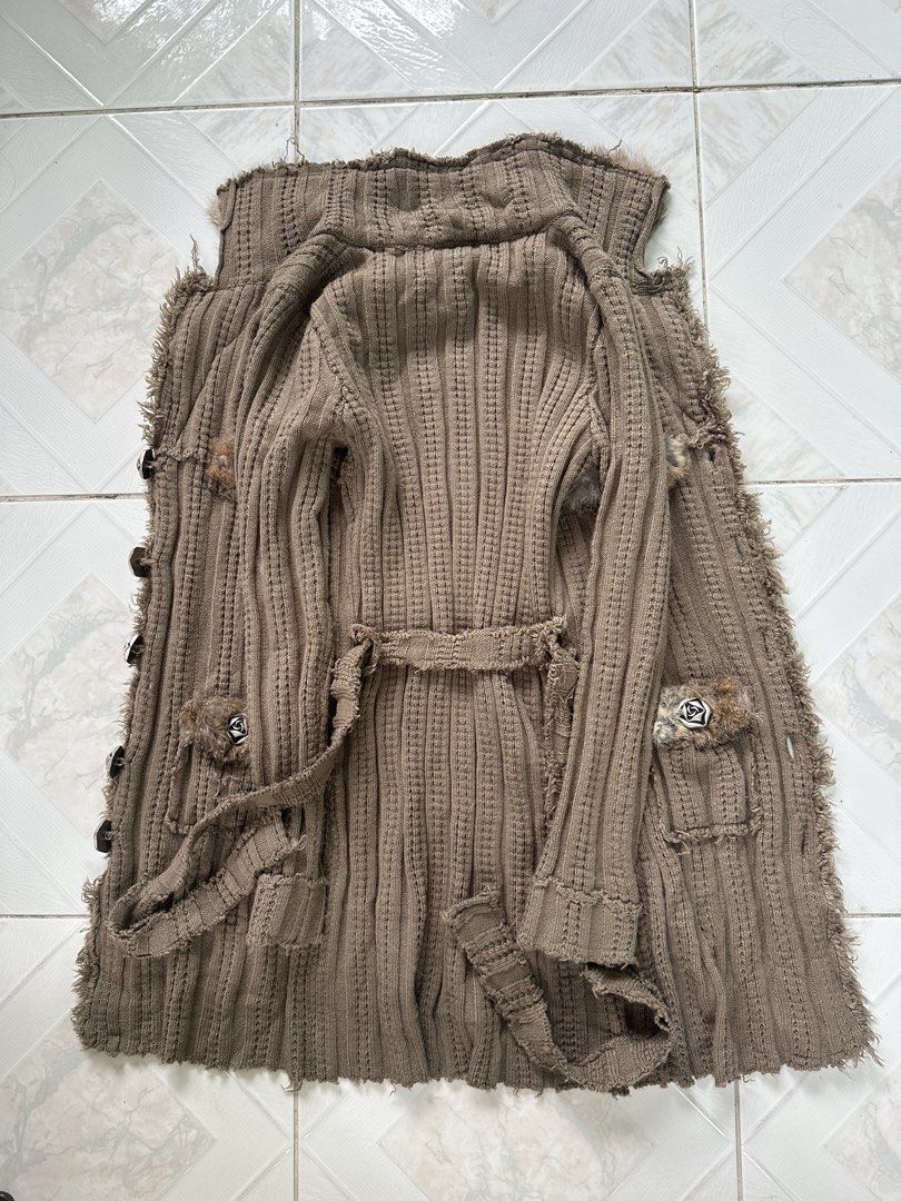 Marc Jacobs y2k 2000s era (Category: Coats, Jackets and Outerwear) located in Manila. Submitted by kupal24 (Listing ID 1467006560, Image 3). Description: Marc Jacobs long cardigan in taupe brown. Made of 70% wool and 30% cotton. Thick ribbed knit material with distressed raw hems and edges. Oversized furry collar and matching fur trim on front pocket flaps. Distinctive flower-shaped silver buttons down the front. Includes a tie belt in the same k