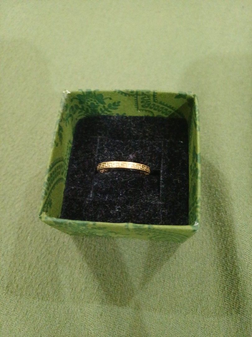 Marigold Philippines 18K F-Ring without Stone (Category: Rings) located in Antipolo. Submitted by momprelovedpage (Listing ID 1467017463, Image 3). Description: - Brand: Marigold Philippines - Material: Genuine 18K Gold - Design: Elegant Greek key pattern band - Condition: Brand new, unworn, and safely stored - Inclusions: Original green patterned ring box with black velvet slot - Source: Purchased from a live shopping session - Style: Simple and