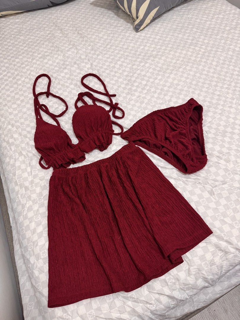 Maroon 3-Piece Bikini Set with Skirt (Category: Bikinis & Swimsuits) located in Cavite. Submitted by zealtree.39df52 (Listing ID 1467110794, Image 1). Description: - Color: Deep maroon - Style: 3-piece swimwear set (halter bikini top, matching bottoms, lightweight skirt wrap) - Fabric: Textured crinkle material - Closure: Adjustable tie straps at neck and back - Condition: used once / Ready for travel.