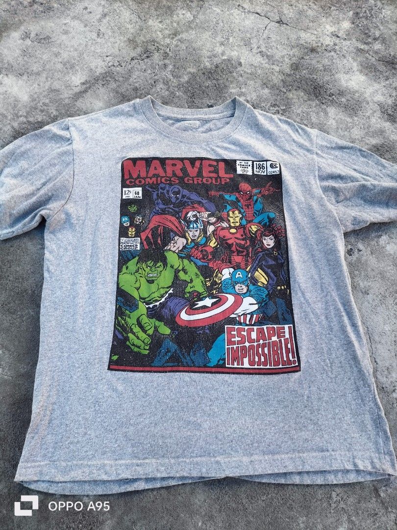 Marvel Comics "Escape Impossible!" Vintage-Style Graphic Tee (Category: Tshirts & Polo Shirts ) located in Alabel. Submitted by hera_juno (Listing ID 1467079977, Image 1). Description: Front print featuring classic retro comic book style art with The Hulk, Captain America, Iron Man, Thor, Spider-Man, and Black Widow. Bold "Escape Impossible!" slogan banner..