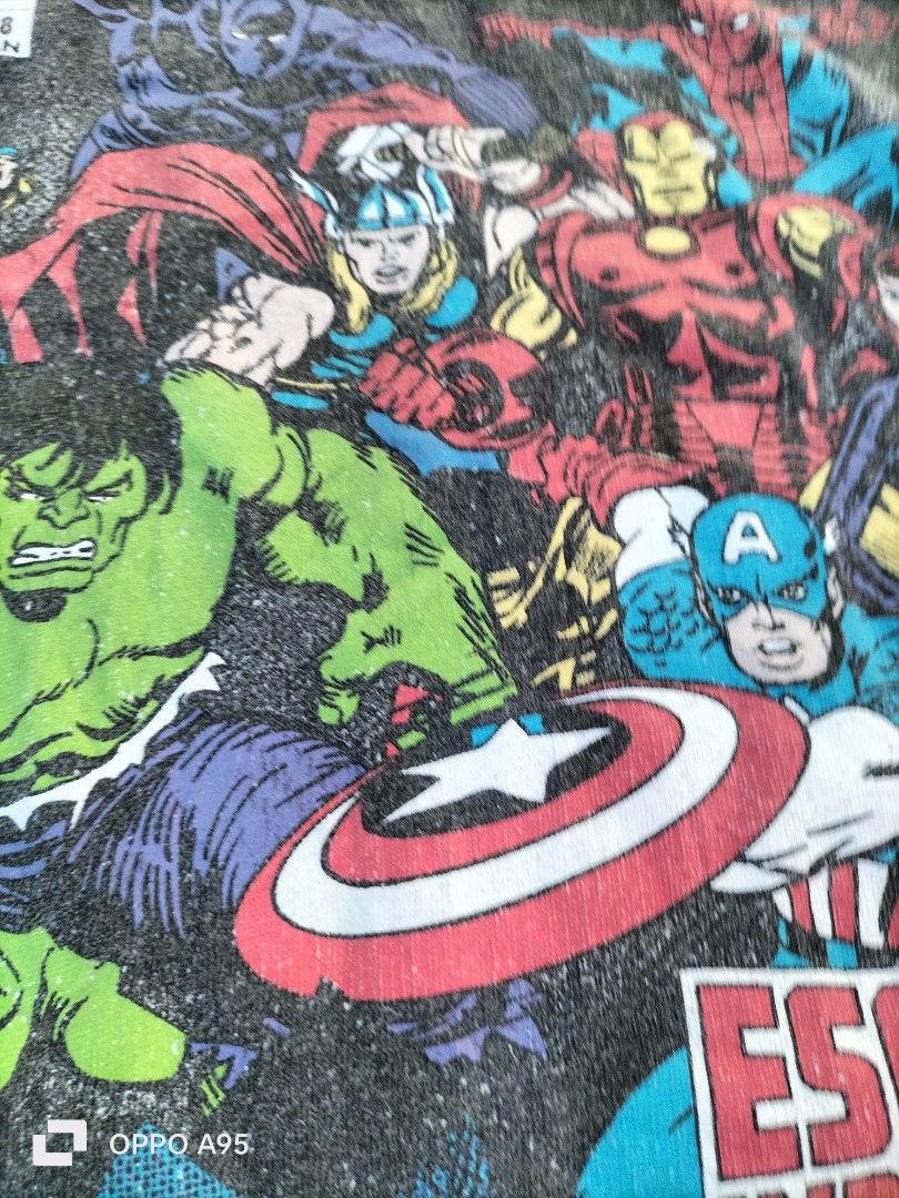 Marvel Comics "Escape Impossible!" Vintage-Style Graphic Tee (Category: Tshirts & Polo Shirts ) located in Alabel. Submitted by hera_juno (Listing ID 1467079977, Image 2). Description: Front print featuring classic retro comic book style art with The Hulk, Captain America, Iron Man, Thor, Spider-Man, and Black Widow. Bold "Escape Impossible!" slogan banner..