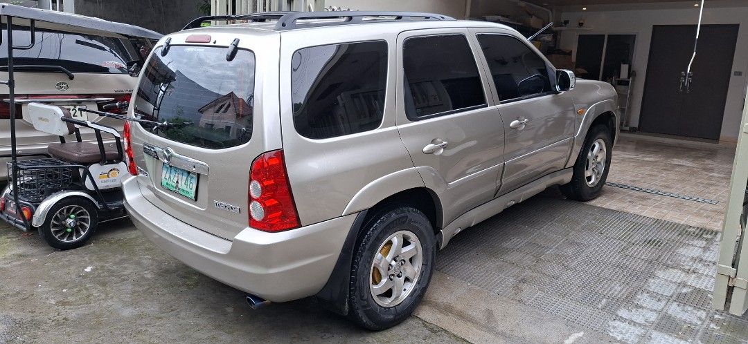 Mazda Tribute Tribute Auto (Category: Used Cars) located in Makati City. Submitted by jbstar40 (Listing ID 1466973212, Image 3). Description: Rush Sale!!! 2005 Mazda Tribute Automatic 2.3L Engine I-4 Sunroof/Moonroof 130,000 kms mileage Full tint OEM wheels Thick tire threads RFS: Parking Issues: Hood paint faded Wednesday coding P160,000 negotiable.