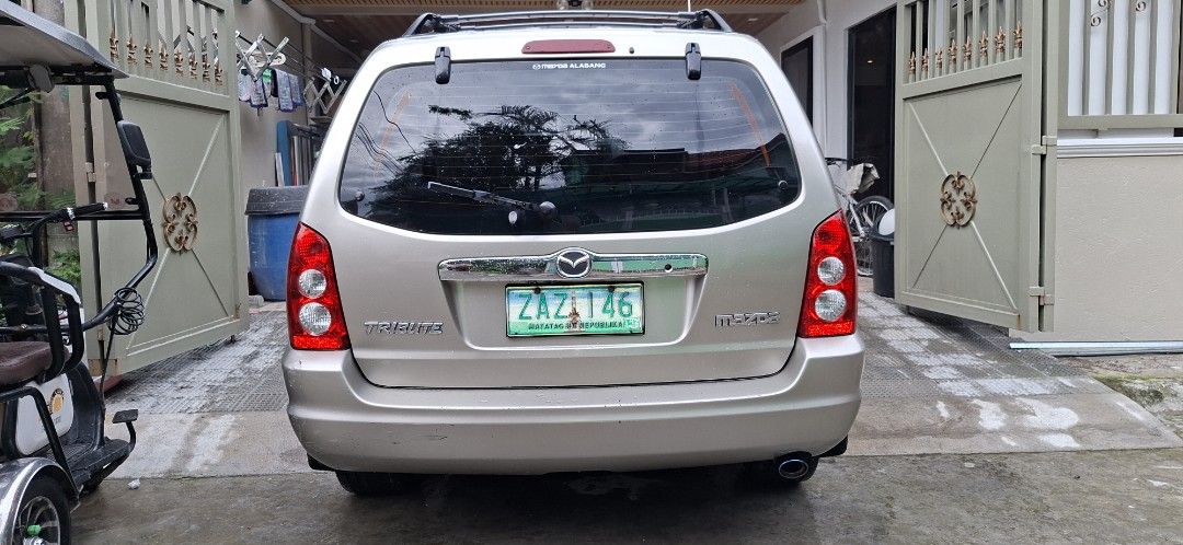 Mazda Tribute Tribute Auto (Category: Used Cars) located in Makati City. Submitted by jbstar40 (Listing ID 1466973212, Image 2). Description: Rush Sale!!! 2005 Mazda Tribute Automatic 2.3L Engine I-4 Sunroof/Moonroof 130,000 kms mileage Full tint OEM wheels Thick tire threads RFS: Parking Issues: Hood paint faded Wednesday coding P160,000 negotiable.