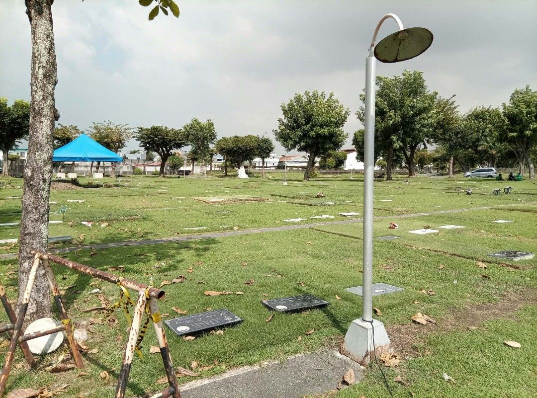 Memorial Lawn Plot in Peaceful Park Cemetery (Category: Gardening Tools & Ornaments) located in Antipolo. Submitted by carcuevalyn5 (Listing ID 1467052685, Image 2). Description: - Peaceful and quiet memorial park location - Well-maintained green grass and mature shade trees - Accessible via paved pathways with ample surrounding space - Transferable rights available - Message for exact location and document details.