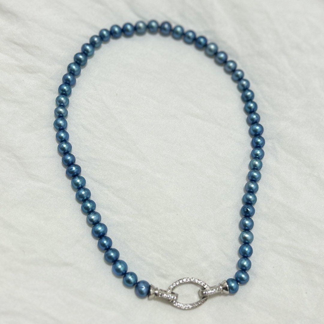 Metallic blue Pearl necklace (Category: Necklaces) located in Lipa City. Submitted by avenueusco_ph (Listing ID 1467010747, Image 2). Description: Color: Metallic blue or peacock blue. Undertone: Deep ocean blue with teal and silvery highlights. Shape: Mostly round to near-round, with slight variations. Luster: Strong, shiny, metallic-looking surface. Size: 6.8mm pearl size and 16inch long.