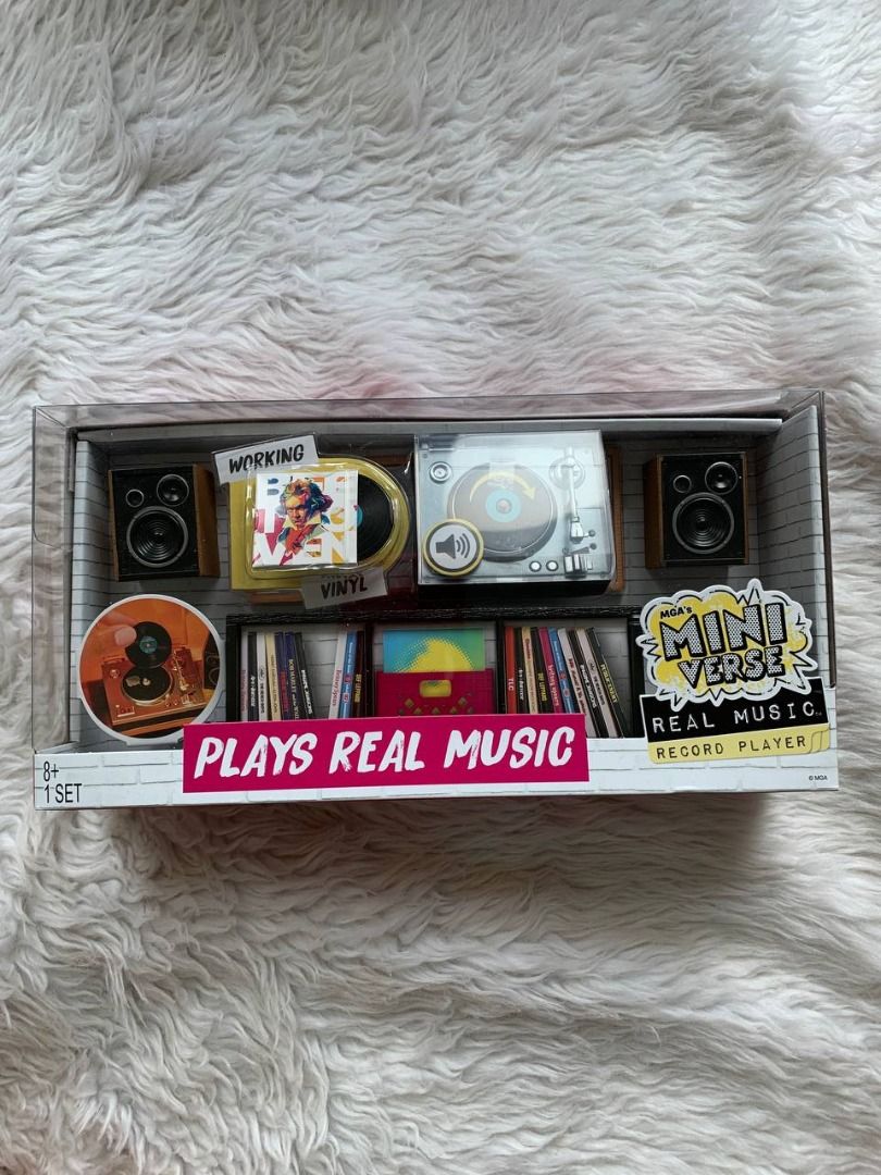 MGA's Miniverse Real Music Record Player Set (Category: Portable Music Players) located in Makati City. Submitted by binspolmat (Listing ID 1467036084, Image 1). Description: - Brand: MGA's Miniverse - Item: Miniature record player set - Condition: Unopened, brand new - Features: Working turntable that plays real music, mini speakers, tiny vinyl records with album art, and miniature storage shelves - Perfect for: Miniature enthusiasts and music f
