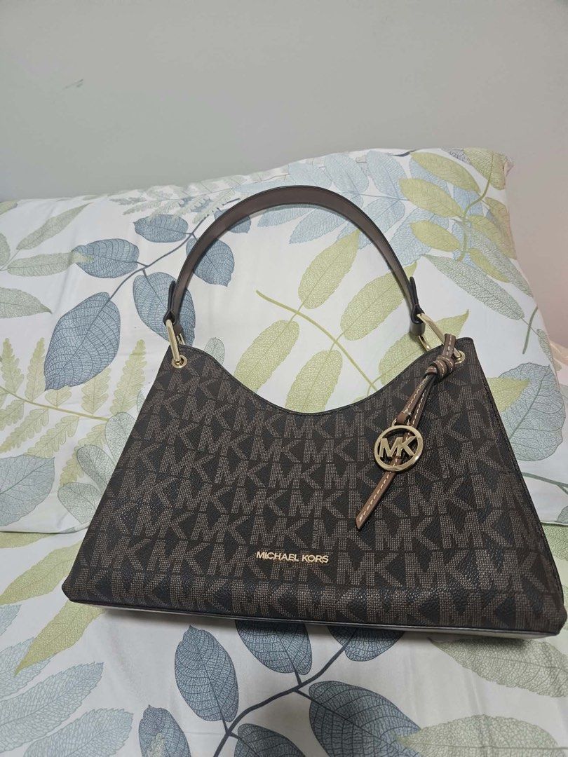 Michael Kors Brown MK Monogram Shoulder Bag (Category: Luxury Bags & Wallets) located in Batangas. Submitted by fmndz (Listing ID 1467042905, Image 3). Description: - Authentic Michael Kors shoulder bag in signature brown MK monogram print - Features contrast brown leather shoulder straps and elegant gold-tone hardware From Canada, arrival on the 4th week of Nov Original price: 19,770 Sale price: 11,000 .