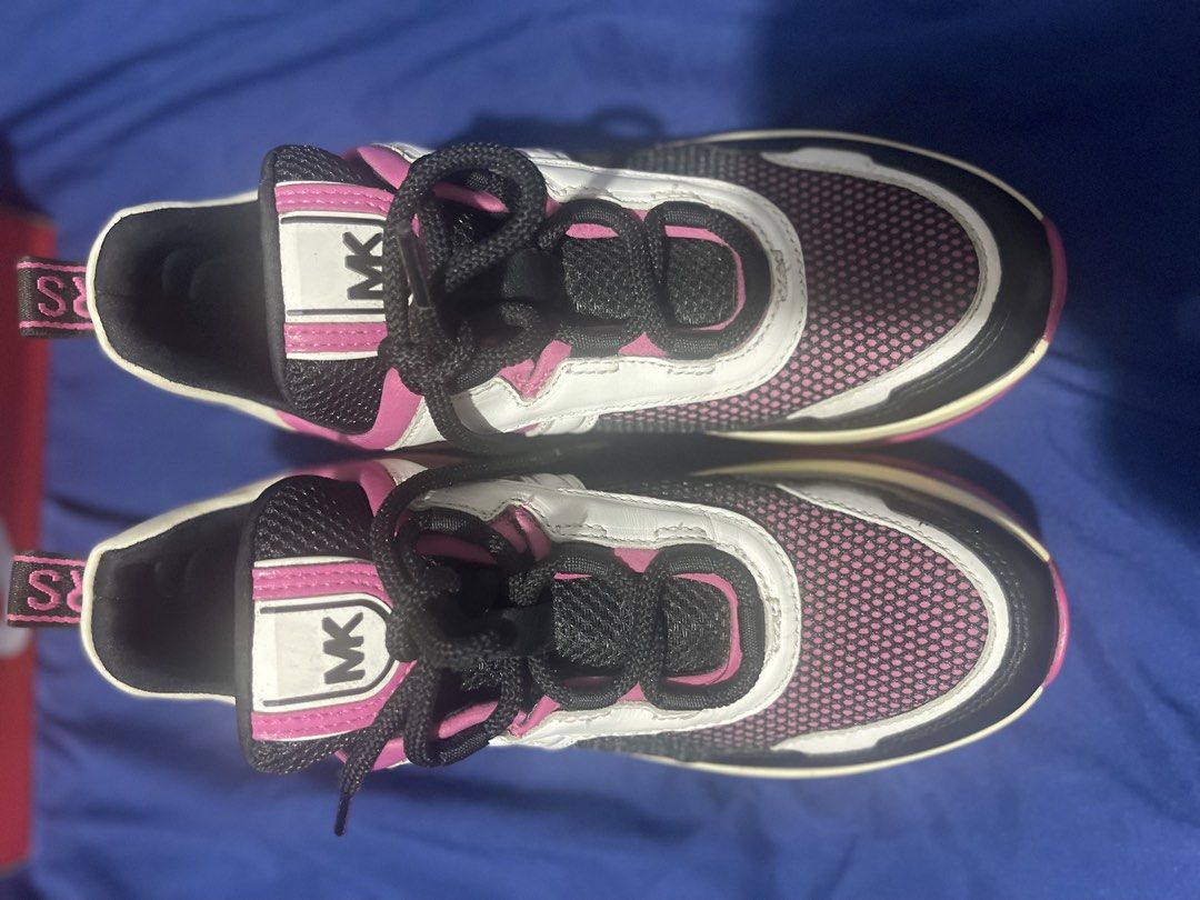 Michael Kors Chunky Sneakers Pink White Black (Category: Sneakers) located in Manila. Submitted by abeline07 (Listing ID 1467159293, Image 2). Description: - size us 6.5 Brand: Michael Kors - Colorway: Pink, White, and Black - Design: Bold chunky sneaker with transparent air-cushion soles - Upper: Breathable mesh panels with MK lettering on the side - Details: Branded ribbon pull tabs at the heel and textured pink rubber outsoles - Condition: Exc