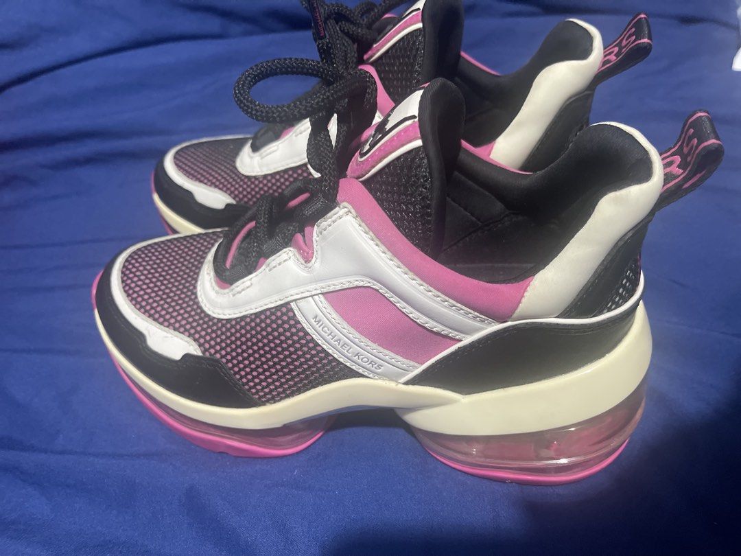 Michael Kors Chunky Sneakers Pink White Black (Category: Sneakers) located in Manila. Submitted by abeline07 (Listing ID 1467159293, Image 3). Description: - size us 6.5 Brand: Michael Kors - Colorway: Pink, White, and Black - Design: Bold chunky sneaker with transparent air-cushion soles - Upper: Breathable mesh panels with MK lettering on the side - Details: Branded ribbon pull tabs at the heel and textured pink rubber outsoles - Condition: Exc