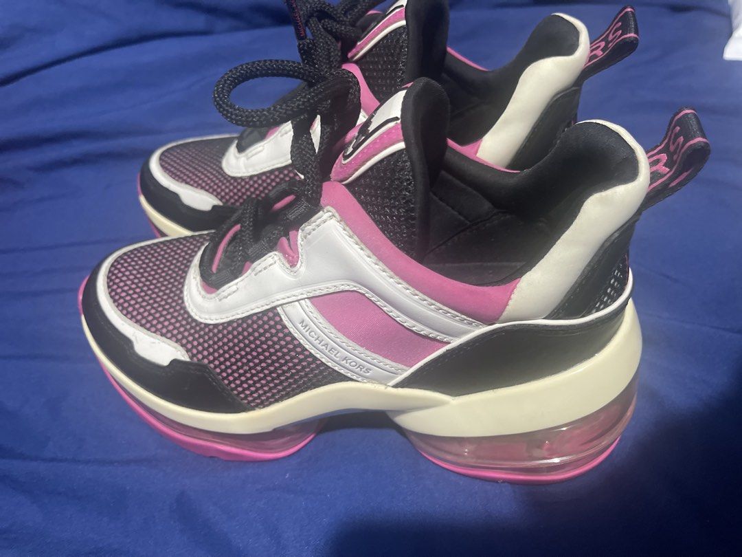 Michael Kors Chunky Sneakers Pink White Black (Category: Sneakers) located in Manila. Submitted by abeline07 (Listing ID 1467159293, Image 1). Description: - size us 6.5 Brand: Michael Kors - Colorway: Pink, White, and Black - Design: Bold chunky sneaker with transparent air-cushion soles - Upper: Breathable mesh panels with MK lettering on the side - Details: Branded ribbon pull tabs at the heel and textured pink rubber outsoles - Condition: Exc
