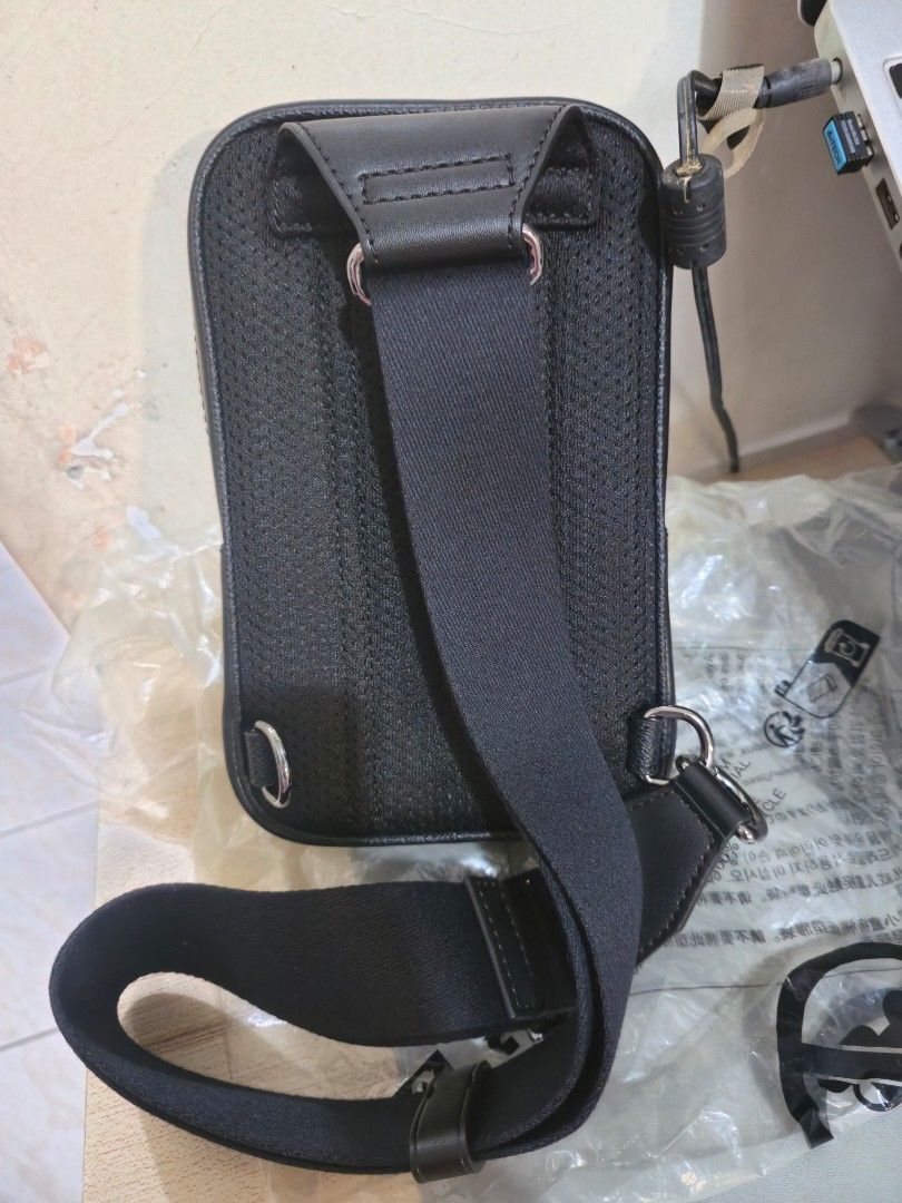 Michael Kor's Cooper Medium Signature Logo Sling Pack (Category: Sling Bags) located in Quezon City. Submitted by karlleseshops (Listing ID 1467113208, Image 3). Description: Michael Kor's Cooper Medium Signature Logo Sling Pack original from US. Details • Sling pack • Logo-print canvas • 89.4% coated canvas/9.6% polyester/1% polyurethane • Gunmetal hardware • 5.1”W X 10.6”H X 2”D • Exterior details: front slip pocket • Interior details: phone po