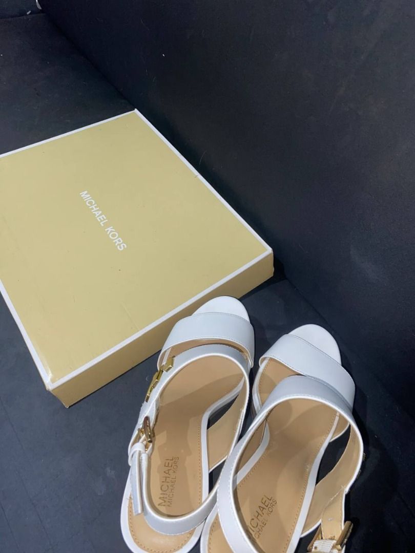 Michael Kors Deanna Wedge (Category: Sneakers & Footwear) located in Pasig City. Submitted by goldenwind.8058bb (Listing ID 1467123182, Image 2). Description: • Color: Optic White • Size: US 7M • Used once only!.
