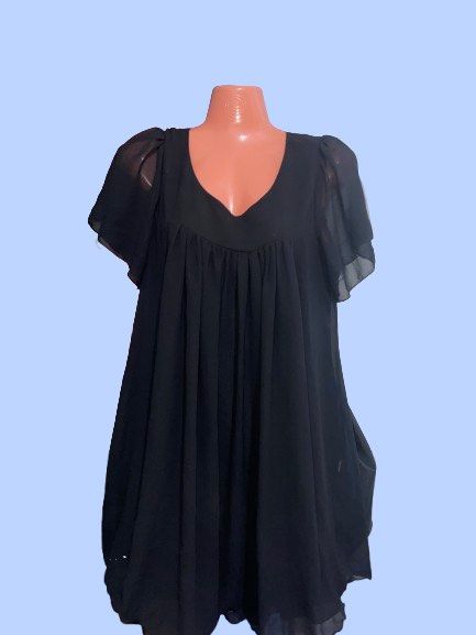 MINGYIREN Black Chiffon Mini Dress (Category: Dresses) located in Manila. Submitted by joclutter (Listing ID 1467083397, Image 1). Description: - Brand: MINGYIREN - Style: Black chiffon mini dress with a flowy, loose silhouette - Details: Scoop neckline, short sheer flutter sleeves, and a gathered pleated bodice - Comfort: Lightweight fabric, fully lined body, and easy pull-on style (no zippers or buttons) - Length: Above the knee - Condition: Ex