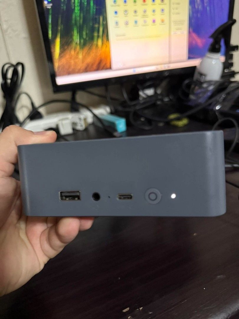 Mini PC AMD Radeon Graphics 475GB Storage (Category: Desktops) located in Manila. Submitted by sultankenb38643 (Listing ID 1467141631, Image 2). Description: Compact mini PC for daily tasks. Runs on Windows 11. Powered by AMD Radeon Graphics. Includes 475GB storage capacity. Front panel equipped with USB port, audio jack, and USB-C port. Power button with indicator light on front. Clean setup, takes up minimal desk space..