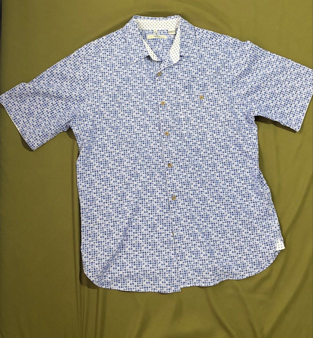 Moda Campia Moda Men's Patterned Short Sleeve Button-Down Shirt (Size M) (Category: Tshirts & Polo Shirts ) located in Mandaluyong City. Submitted by jowsijoe (Listing ID 1466983259, Image 2). Description: Comfortable stretch fabric (92% Polyester / 8% Spandex) Very lightly used. No noticeable stains, tears, or fading. Mandaluyong Area. MOP: BPI/GCash/MariBank Delivery: Lalamove/Grab Express. Fee to be shouldered by buyer. Strictly no meetups..