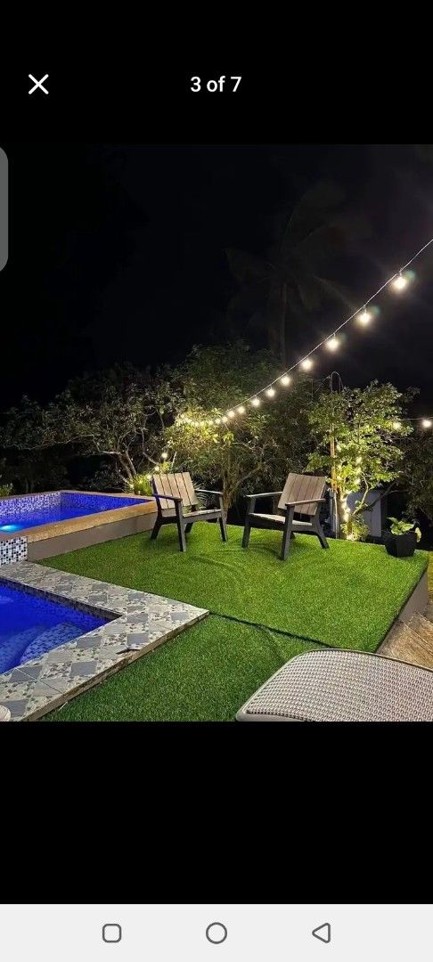 Modern resort accommodation with pool and scenic mountain view (Category: House & Lot) located in Manila. Submitted by jef09754 (Listing ID 1467006311, Image 3). Description: - Modern private resort with capsule-style rooms and scenic mountain views - Clean swimming pool set on artificial turf with sun loungers and string lights - Air-conditioned rooms featuring comfortable queen-size beds, wooden accents, and en-suite seating areas - Surrounded 