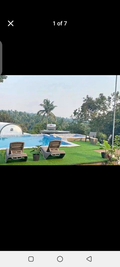 Modern resort accommodation with pool and scenic mountain view (Category: House & Lot) located in Manila. Submitted by jef09754 (Listing ID 1467006311, Image 1). Description: - Modern private resort with capsule-style rooms and scenic mountain views - Clean swimming pool set on artificial turf with sun loungers and string lights - Air-conditioned rooms featuring comfortable queen-size beds, wooden accents, and en-suite seating areas - Surrounded 
