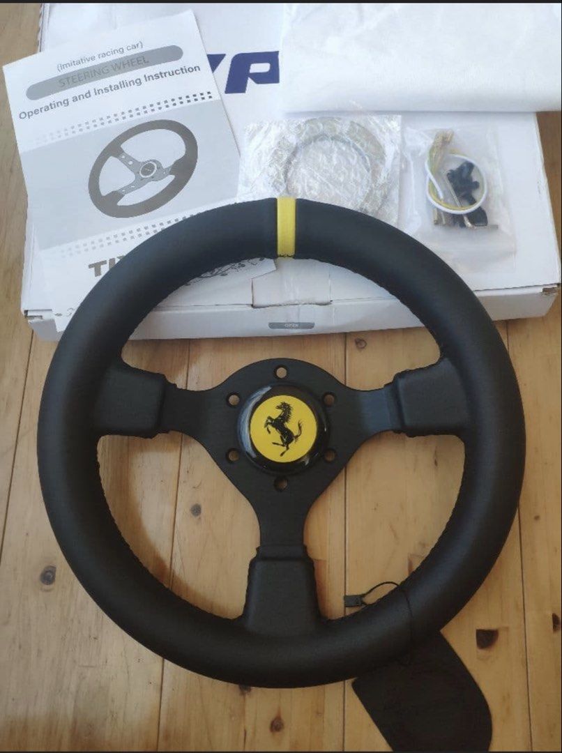 Momo Indy Wood Steering Wheel (Category: Steering, Brakes, Control Parts and Accessories) located in Muntinlupa City. Submitted by vintageboxfinds (Listing ID 1467044174, Image 3). Description: - Authentic Momo Indy wood steering wheel - Features stylish silver slotted spokes and included horn button - Classic vintage style with a natural wood grain rim finish - Ideal upgrade for older car setups and interior restoration projects - Condition: Bra