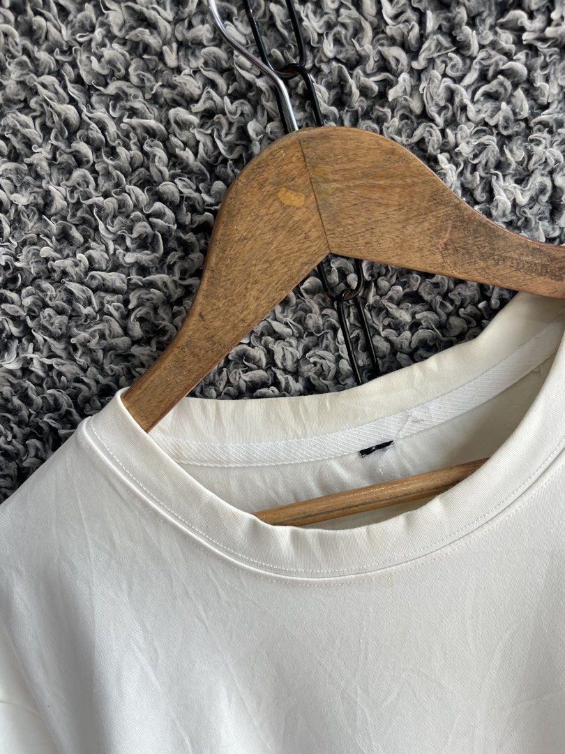 Moncler short-sleeve crew-neck | Size M (Category: Tshirts & Polo Shirts ) located in General Trias. Submitted by zrchustle.604 (Listing ID 1466975643, Image 3). Description: Moncler short-sleeve crew-neck cotton T-shirt in an off-white or eggshell color featuring an embroidered logo patch on the chest and a smaller logo detail on the sleeve..