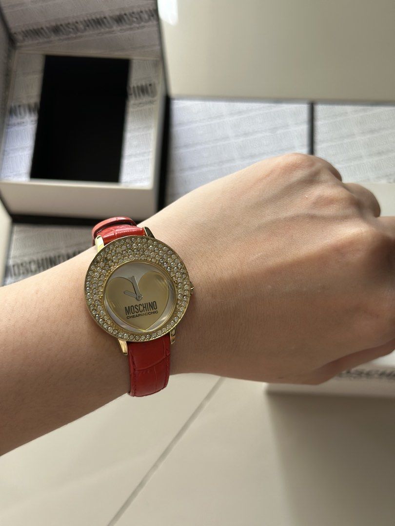 Moschino Cheap and Chic Analog Wristwatch (Category: Women's Watches) located in Pasig City. Submitted by claysome (Listing ID 1466993503, Image 2). Description: -Original Red Strap -Comes with Original Box -Gold-tone Bezel Set with Rhinestones -10/10.